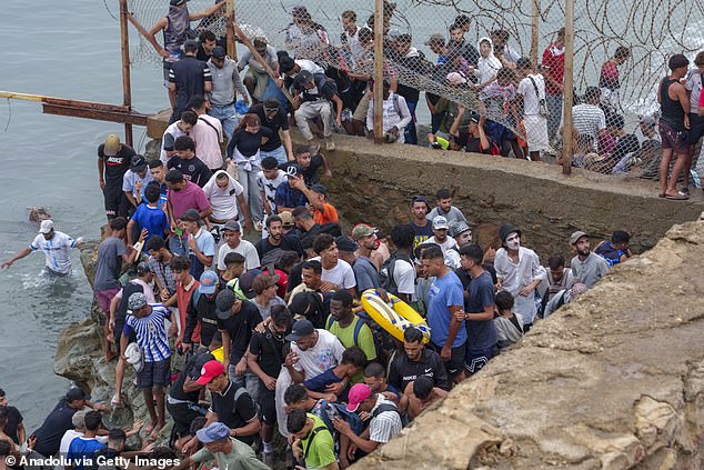 Ministers are under pressure to stop thousands of Africans who stormed a Spanish territory from reaching the UK