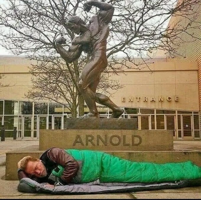 The Famous Actor Arnold Schwarzenegger Posted a Photo of Himself Sleeping on the Street, Under his Famous Bronze Statue, and Sadly Wrote: “How Times have Changed” …