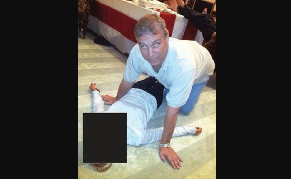 EPSTEIN FILES: Newly Released Photos Show Britain’s Prince Andrew Crouched Over a Woman Lying on the Floor, Staring at the Camera
